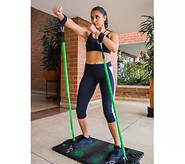 Woman exercising with resistance bands on a platform in a home setting